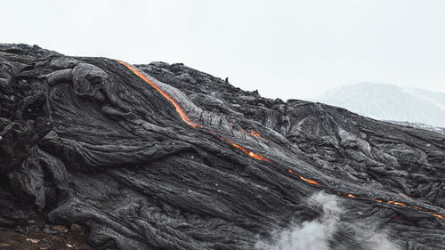 Scenic view of volcanic mountain against sky