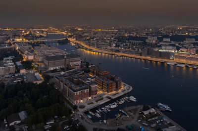 High angle view of illuminated buildings in city at night