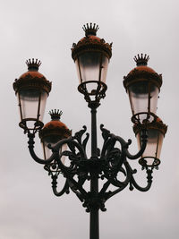 Low angle view of street light against sky