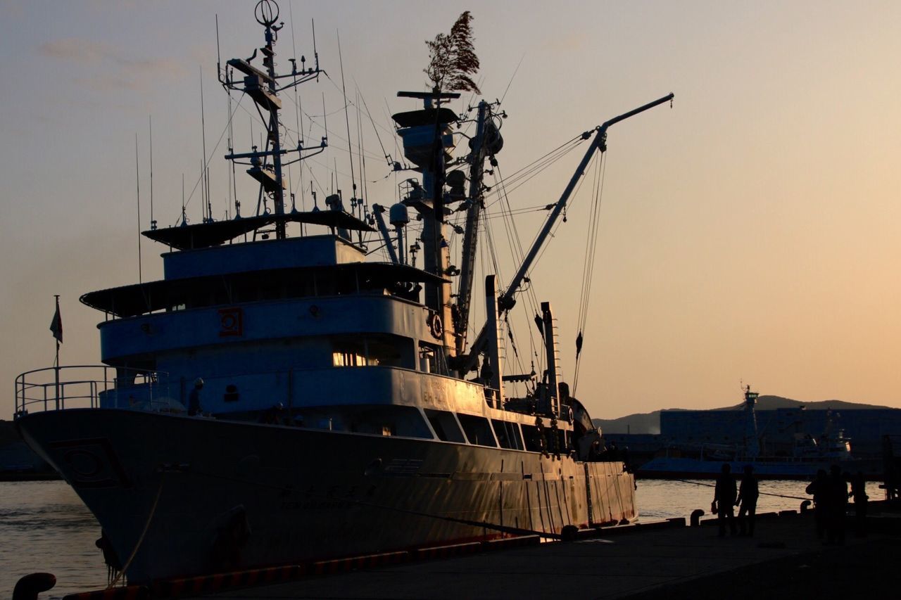 SHIP MOORED AT HARBOR