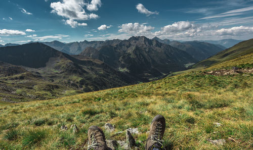 Scenic view of mountains against cloudy sky