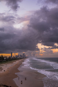 Scenic view of beach against sky during sunset