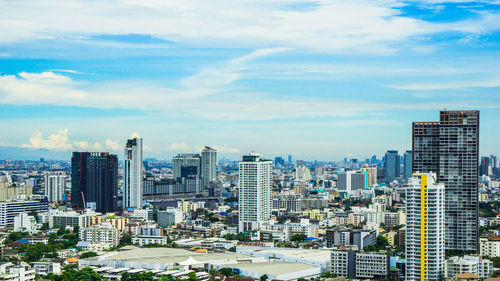 Modern buildings in city against sky