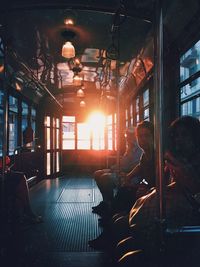 People sitting in illuminated room