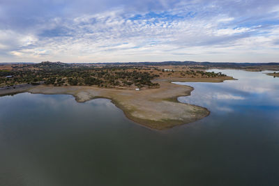Drone aerial panorama of a dam lake reservoir landscape in terena, portugal