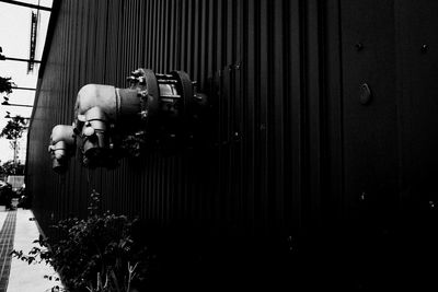 Portrait of man photographing against wall