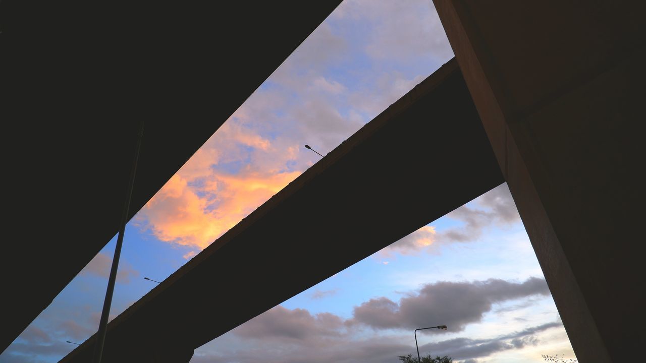 sky, cloud, architecture, light, reflection, built structure, nature, silhouette, no people, sunlight, low angle view, transportation, blue, outdoors, sunset, window