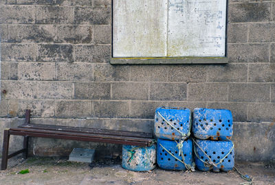 Old shoes on wall of building