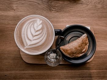 Directly above shot of coffee cup on table
