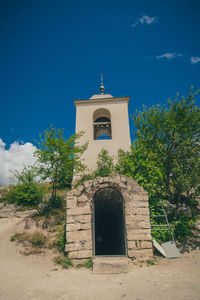 Exterior of historic building against blue sky