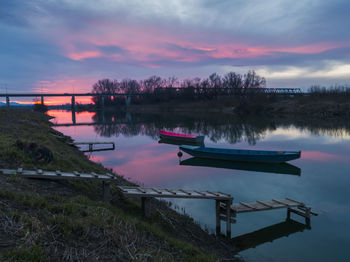 Scenic view of lake against sky during sunset