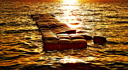 Reflection in sea against sky during sunset
