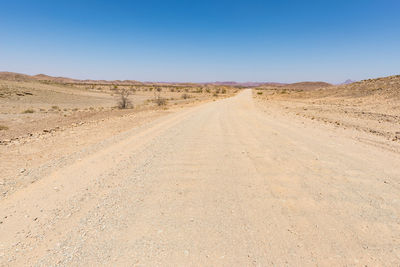 Scenic view of desert against clear sky