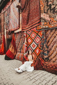 Portrait of woman sitting on bed