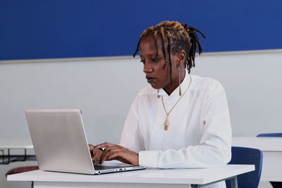 Man using laptop on table