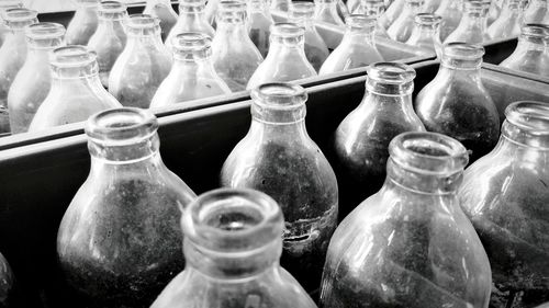 Close-up of bottles in container