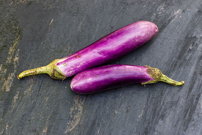High angle view of purple chili peppers on table