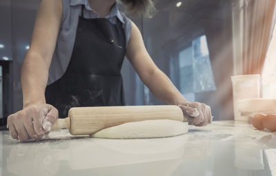 Midsection of woman preparing food