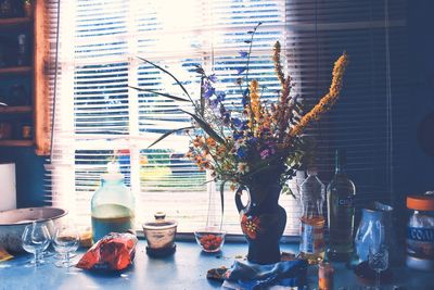 Flower vase on table at home