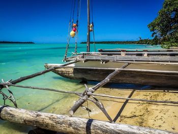 View of boats in calm blue sea