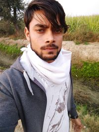 Portrait of young man standing outdoors