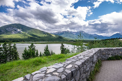 Scenic view of lake and mountains against sky