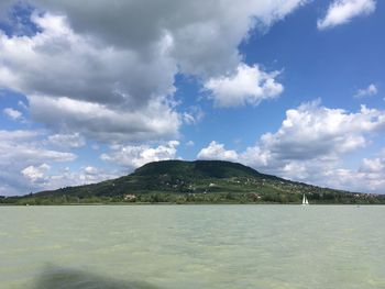 Scenic view of sea against cloudy sky