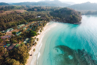 High angle view of sea and mountains against sky