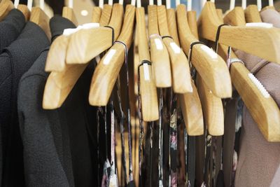 Close-up of ties and blazers hanging from hangers