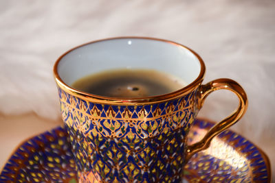 Close-up of coffee cup on table