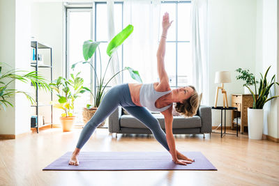 Young woman exercising in gym