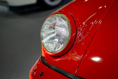 Close-up of red car headlight
