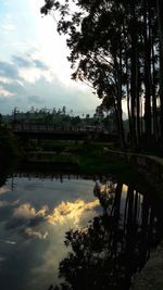 Scenic view of lake against sky at sunset