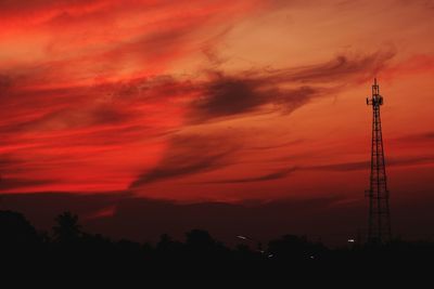 Low angle view of silhouette tower against sky during sunset