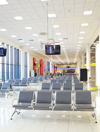 Empty chairs in airport building