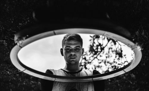 Portrait of teenage boy with reflection