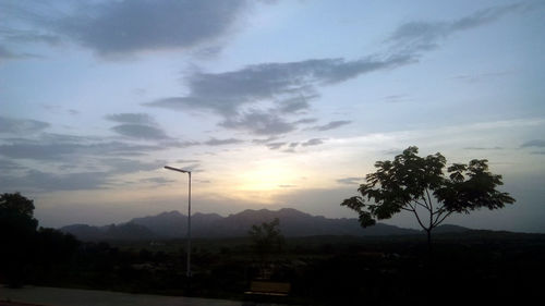 Scenic view of landscape against cloudy sky