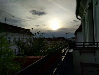 Buildings against sky at sunset