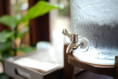 Close-up of faucet in bathroom