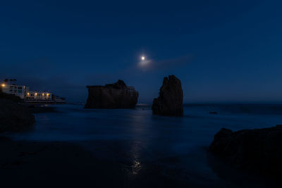 Scenic view of sea against sky at dusk