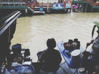 People sitting on boat in water