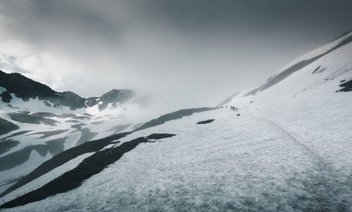 Snow covered mountain against sky