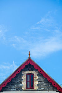 Low angle view of building against blue sky