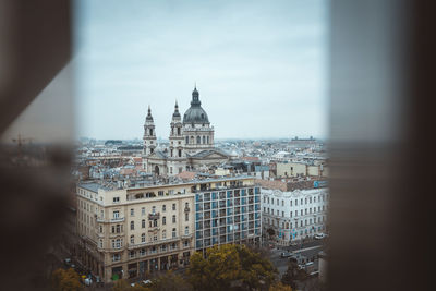 Buildings in city against sky