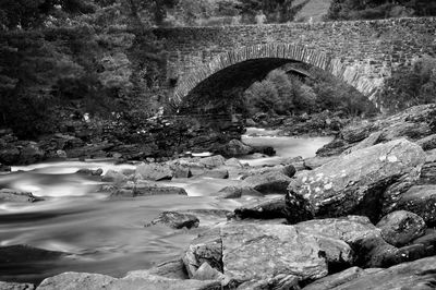 Narrow stream along stone