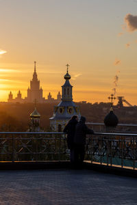Low angle view of buildings against sky during sunset