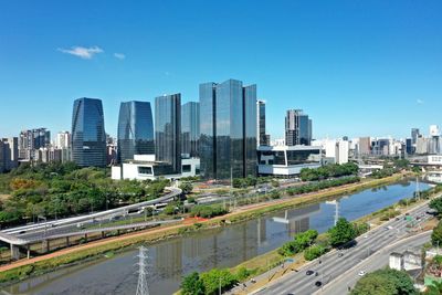 View of city buildings against clear sky