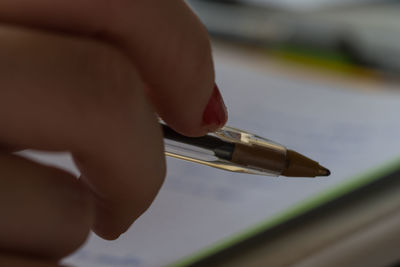 Close-up of person holding cigarette