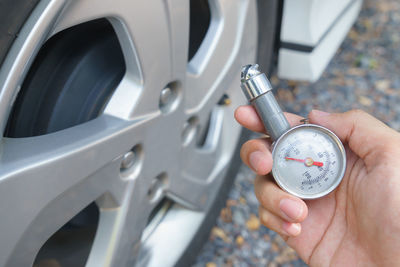 Close-up of hand holding machine