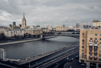 High angle view of bridge over river by buildings in city